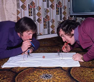 John Brownlie of Hibernian and Dixie Deans of Celtic playing blow football December 1972