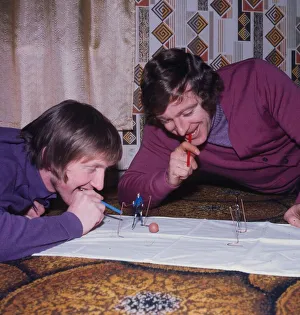 John Brownlie of Hibernian and Dixie Deans of Celtic playing blow football December 1972