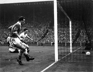 Home International Prints: John Charles of Wales left scores against England in the international match between