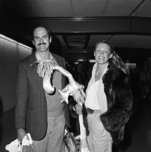 Toys Prints: John Cleese actor comedian with wife Barbara Trentham at LAP. 24th February 1981