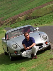Vehicles And Transport Prints: John Clelland sitting in front of a silver grey TVR Cerbera car August 1997