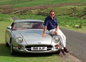 John Clelland sitting on a silver grey TVR Cerbera car August 1997 B16 AJP