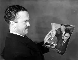 John Cobbold Dec 1959 Ipswich FC Chairman looks at a picture of the FA cup draw which put