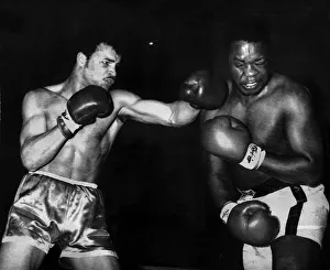 John Conteh Boxer lands a left hook to David Matthews Jaw during their fight