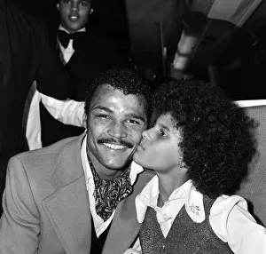 John Conteh celebrates with family aboard a playboy motor coach after winning world title