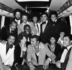 John Conteh celebrates with family aboard a playboy motor coach after winning world title