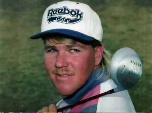 John Daly on golf course with killer whale golf club over his shoulder Muirfield outdoors