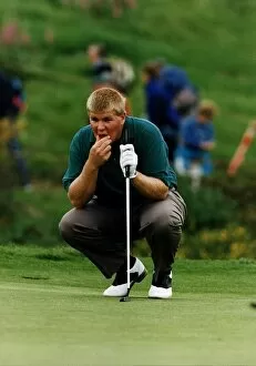 Images Dated 1st July 1994: John Daly kneels to contemplate shot holding putter golf Scottish Open at Gleneagles