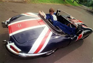 Jaguar Prints: John Dingwall dressed as Austin Powers in E Type Jaguar car September 1999 Union Jack