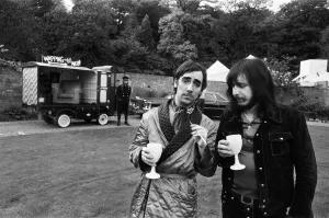 John Entwistle and Keith Moon of the rock group The Who show off their new cars