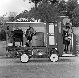 John Entwistle and Keith Moon of the rock group The Who show off their new cars