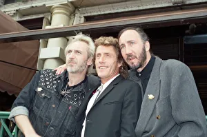 John Entwistle, Pete Townshend and singer Roger Daltrey of The Who rock group pat