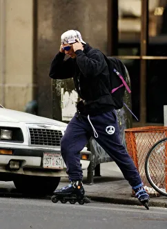 Democratic Prints: John F Kennedy Jnr the son of assassinated President JFK roller blading through New York