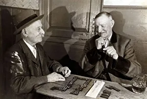 Pub Games Prints: John Golding and colleague drinking beer and playing dominos at The Carpenters Arms
