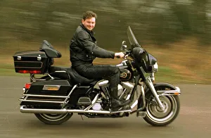 John Gordon Sinclair actor riding his Harley Davidson Electra Glide motorcycle