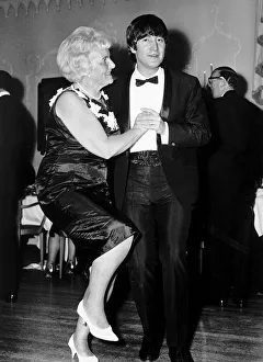 John Lennon dancing with Mrs Louise Harrison mother of George Harrison at the Dorchester