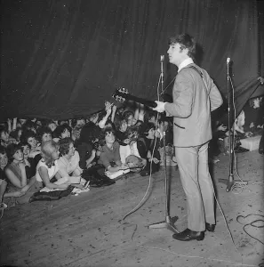 John Lennon looks to the wings during the Beatles last British ballroom appearance
