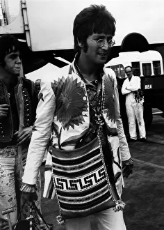 John Lennon and Paul McCartney arriving at Heathrow Airport from their Greek Holiday