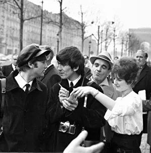 John Lennon, Paul MCCartney and George Harrison on the Champs Elysees before Ringo