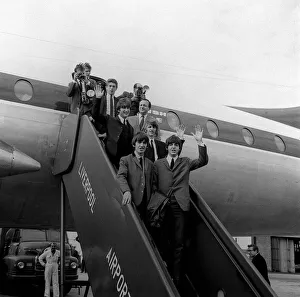 John Lennon, Paul McCartney, George Harrison and Ringo Starr leaving the aircraft
