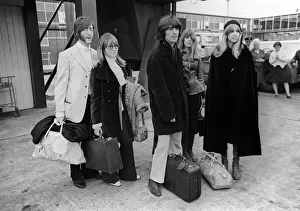 00097 Prints: John Lennon with wife Cynthia and George Harrison and his wife Patti Boyd at Heathrow