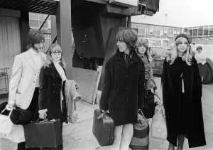 John Lennon with wife Cynthia and George Harrison and his wife Patti Boyd at Heathrow