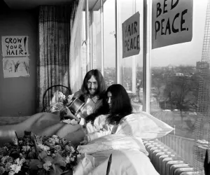 John Lennon and his wife Yoko Ono are having a weeks love-in their room at the Hilton
