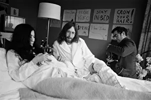 John Lennon and his wife Yoko Ono stage a bed in in a hotel in Amsterdam