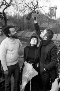 John Lennon and Yoko pictured on the roof of Black House in Holloway Road, with Michael X