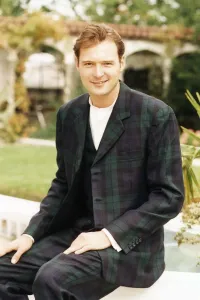 00160 Prints: John Leslie TV Presenter sitting wearing tartan suit