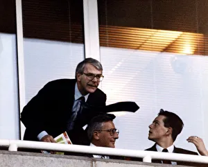 John Major British Prime Minister talks to his son James during the Arsenal-Aston Villa