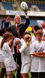 John Major MP Prime Minister tries his hand at the sport with schoolchildren during an