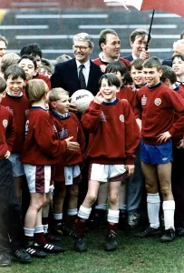 John Major Prime Minister with young footballers at Heart of Midlothian football ground
