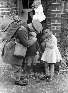 Hello Prints: John Maynard, back from leave. Picture shows him re-united with children and a lady