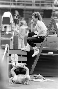 00062 Prints: John McEnroe, with a foot bandaged and leather support seen here during training running