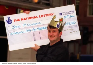 John McGuinness holding National Lottery cheque for £10, 055, 900