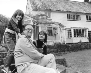 John Mortimer QC with his wife Penny and seven year old daughter Emily at their home in