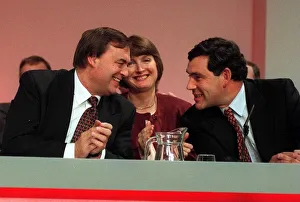Clapping Prints: John Prescott talks to Gordon Brown with Harriet Harman centre on the platform at th