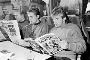 Magazine Prints: John Scales (left - reading The Evening Standard) travelling on the team coach