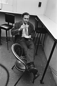 John Stonehouse Postmaster General and MP for West Bromwich enjoys a cup of tea after