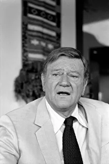60 70 Years Prints: John Wayne who recently starred in Brannigan photographed at home in Texas