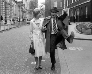 John Wells with Angela Thorne in Anyone for Denis'standing in Downing street