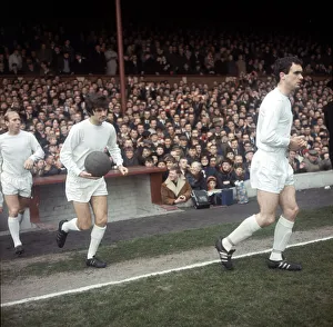 Johnny Aston leads Manchester United team mates George Best & Bobby Charlton onto