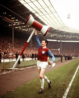 Johnny Byrne Football player for West Ham United runs around the pitch at Wembley with a