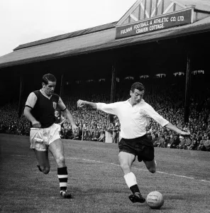 Johnny Haynes of Fulham in action against Burmely during their League division one match