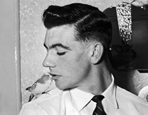 00326 Prints: Johnny Haynes of Fulham FC with his pet Budgie Bimbo 16th October 1955