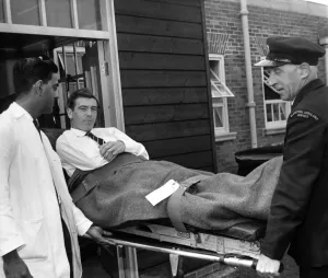 00250 Prints: Johnny Haynes leaves Hospital. England and Fulham Soccer star Johnny Haynes is carried