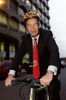 Jon Snow TV Presenter December 1998 Cahnnel 4 newscaster sitting on his pushbike