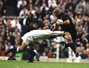 Rugby Prints: Jonah Lomu scoring a try Oct 1999 breaks the tackle of Jeremy Guscott to go