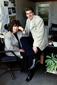 Jonathan Ross TV Presenter sitting on desk with his mother Maureen